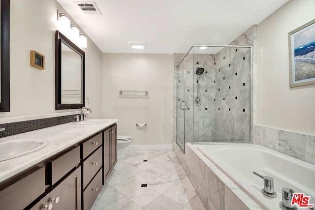 full bathroom with vanity, separate shower and tub, and toilet