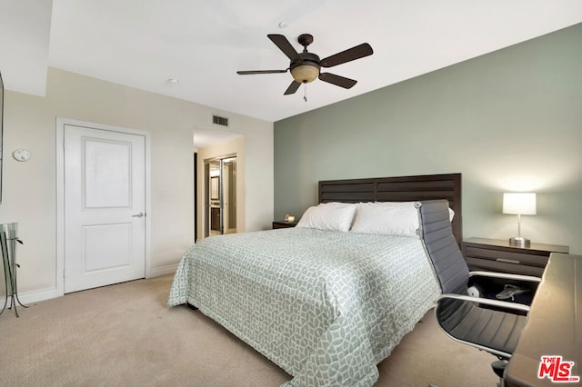 bedroom with ceiling fan and light colored carpet