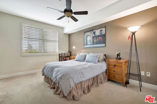 bedroom featuring ceiling fan and light colored carpet