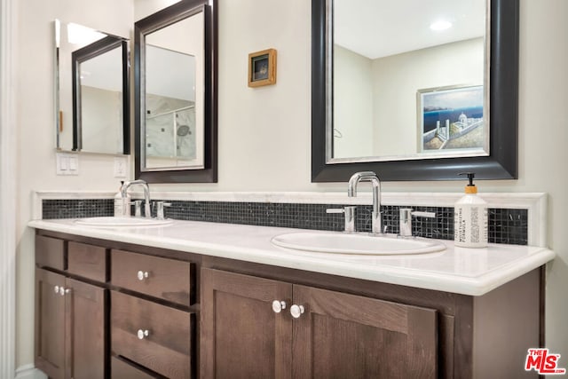 bathroom with vanity and backsplash