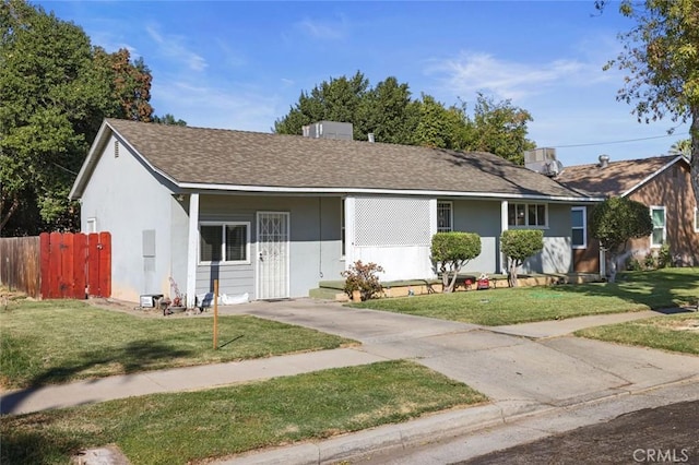 ranch-style home with a front lawn