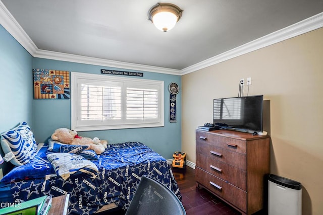 bedroom featuring crown molding and dark hardwood / wood-style floors