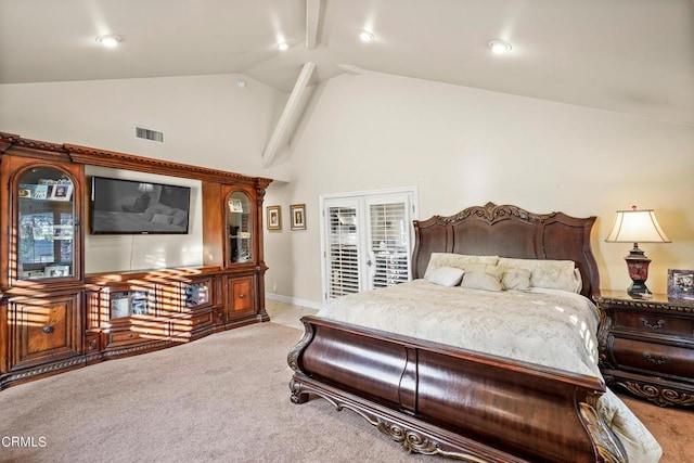 carpeted bedroom featuring high vaulted ceiling