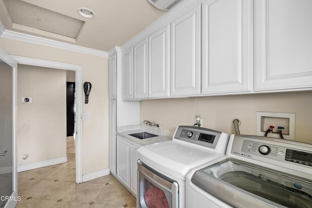 washroom featuring sink, cabinets, light tile patterned flooring, washer and dryer, and ornamental molding