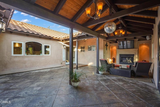 view of patio with an outdoor fireplace