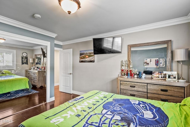 bedroom featuring crown molding and dark wood-type flooring