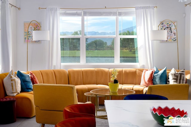 tiled living room featuring a healthy amount of sunlight