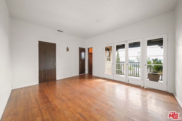 empty room featuring hardwood / wood-style flooring