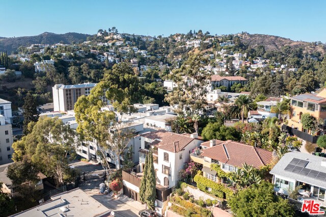 birds eye view of property with a mountain view