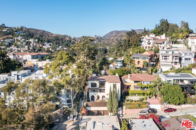 birds eye view of property with a mountain view