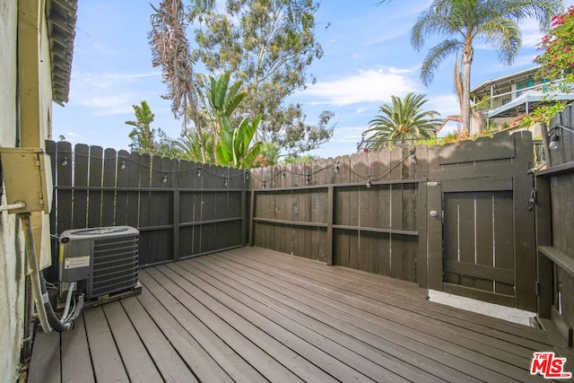 wooden deck with central AC unit