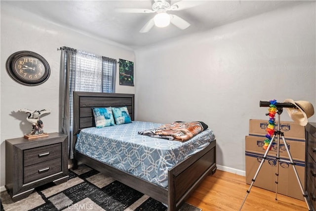 bedroom featuring light hardwood / wood-style flooring and ceiling fan