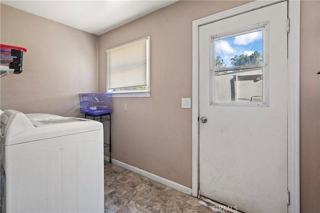 washroom with washer / dryer