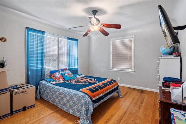 bedroom featuring ceiling fan and light hardwood / wood-style flooring