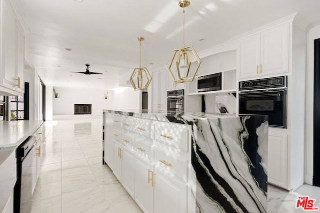 kitchen featuring white cabinetry, stainless steel microwave, oven, and dishwashing machine