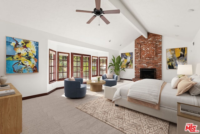 carpeted bedroom with vaulted ceiling with beams, ceiling fan, and a brick fireplace