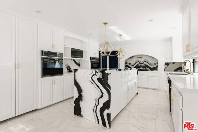 kitchen with white cabinetry, sink, black appliances, and decorative light fixtures