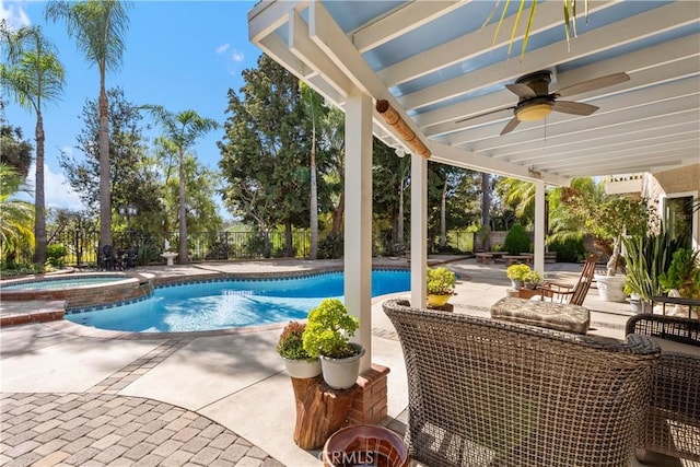 view of swimming pool featuring a patio area, ceiling fan, and an in ground hot tub