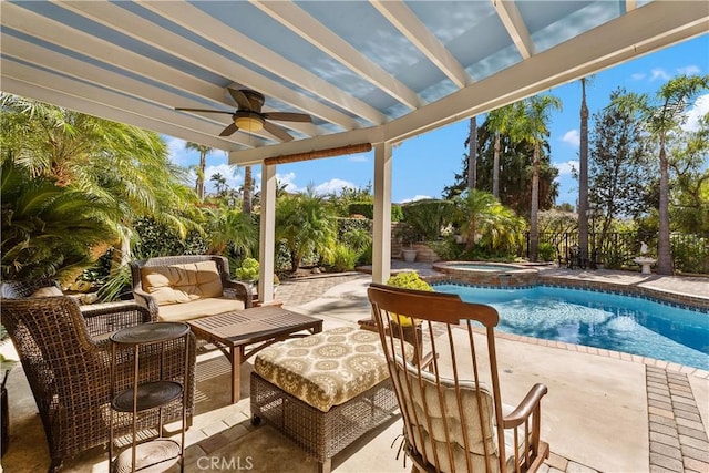 view of patio / terrace featuring outdoor lounge area, ceiling fan, and a pool with hot tub