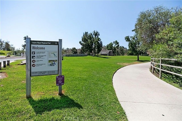 view of property's community with a lawn