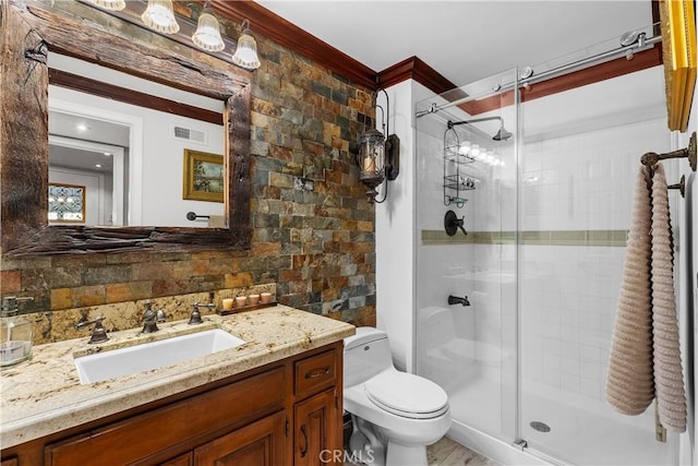 bathroom with decorative backsplash, an enclosed shower, vanity, crown molding, and toilet