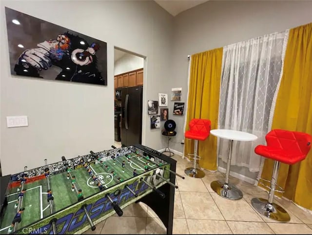 game room featuring light tile patterned floors