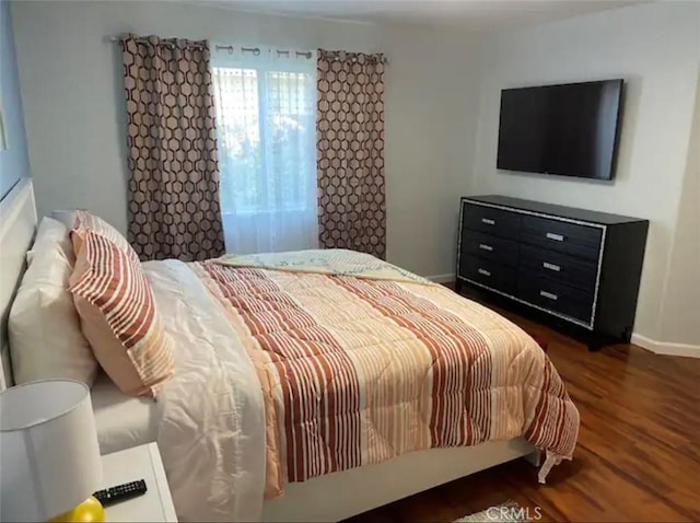 bedroom featuring dark wood-type flooring