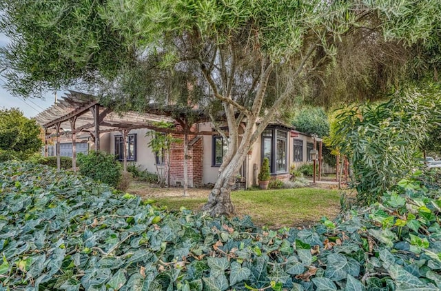 view of front facade featuring a pergola