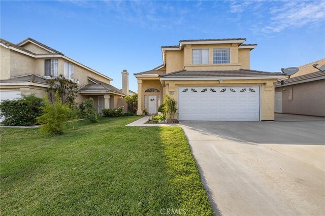 view of front of house with a garage and a front lawn