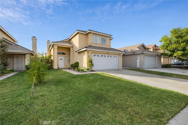 view of property with a front yard and a garage