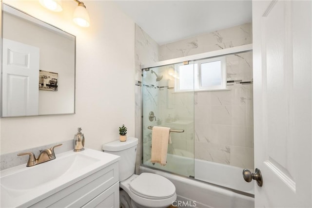 full bathroom with vanity, toilet, and enclosed tub / shower combo