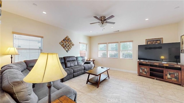 tiled living room featuring ceiling fan