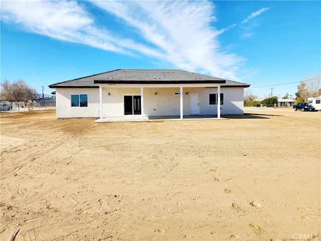 rear view of house with a patio