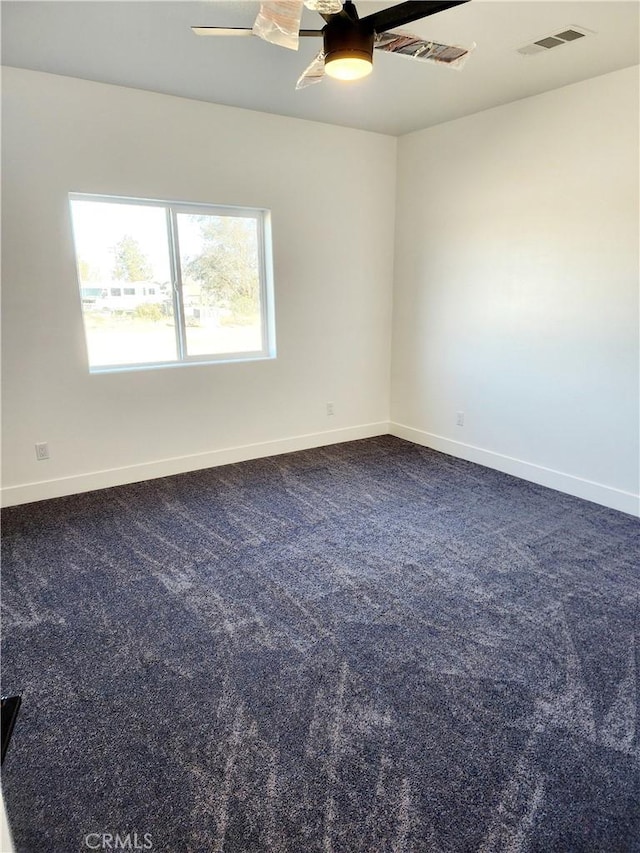 carpeted empty room with ceiling fan