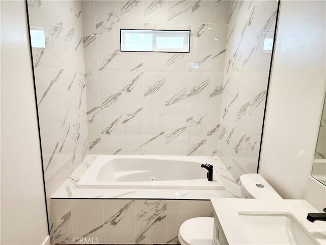 bathroom featuring toilet and vanity