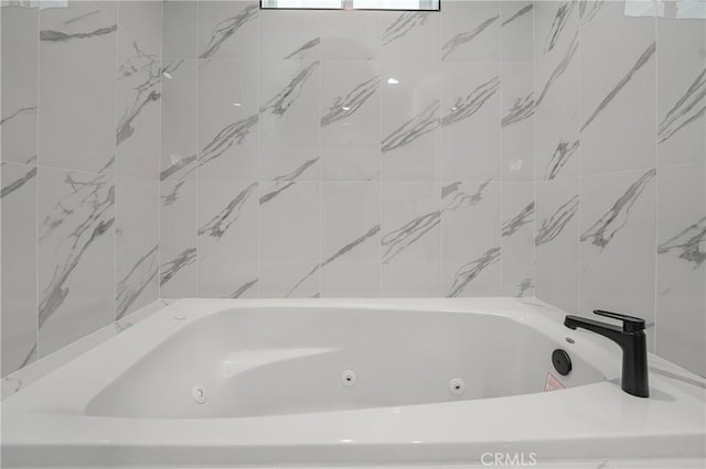 full bath featuring a whirlpool tub