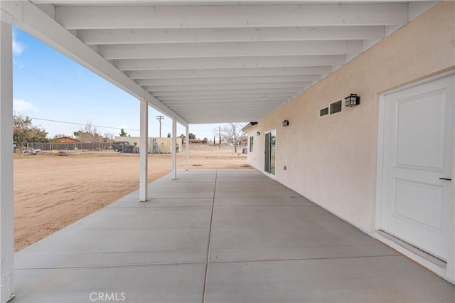 view of patio featuring fence