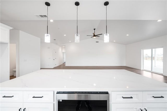 kitchen featuring wine cooler, open floor plan, visible vents, and lofted ceiling