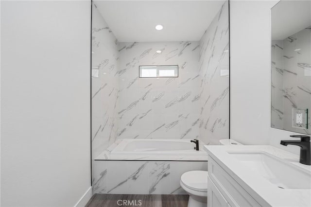 full bathroom with toilet, wood finished floors, and vanity