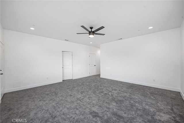 spare room with ceiling fan, baseboards, dark colored carpet, and recessed lighting