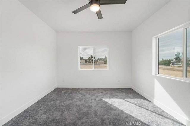 unfurnished room featuring baseboards, a wealth of natural light, and carpet flooring