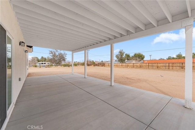 view of patio featuring fence