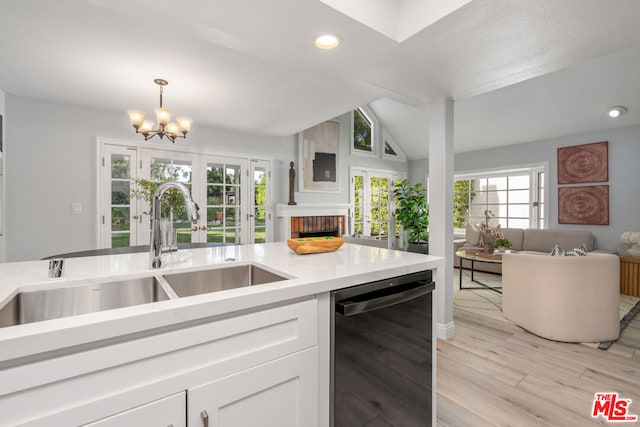 kitchen featuring french doors, sink, dishwasher, light hardwood / wood-style floors, and white cabinetry