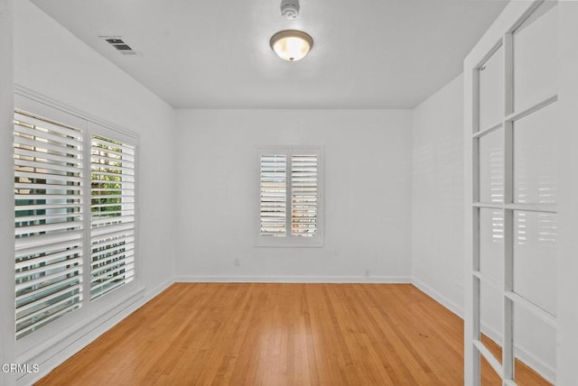 unfurnished room with light hardwood / wood-style flooring