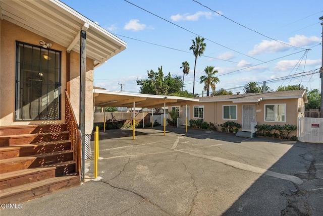 view of vehicle parking featuring a carport