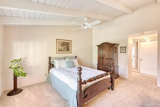 carpeted bedroom with ceiling fan and lofted ceiling with beams