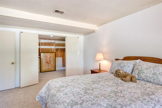 carpeted bedroom with a closet