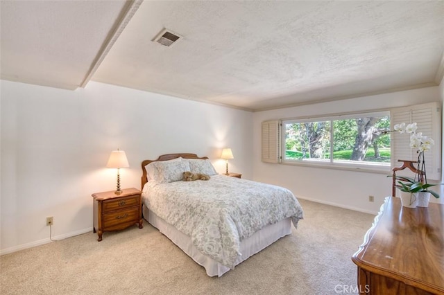 bedroom featuring light carpet and crown molding