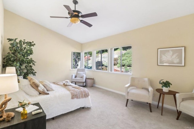 bedroom featuring carpet, vaulted ceiling, and ceiling fan