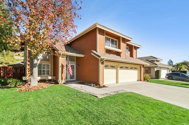 view of front of home with a garage and a front lawn